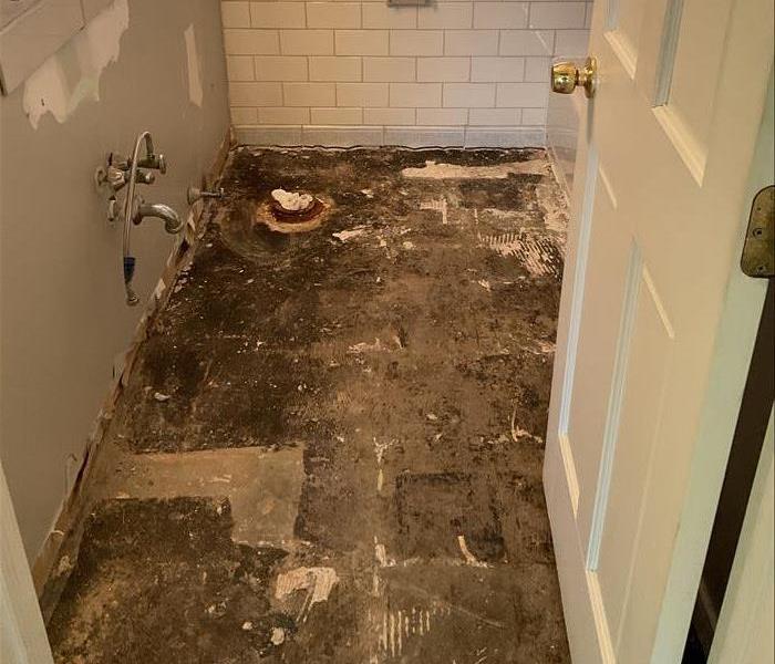 image of water damaged bathroom floor