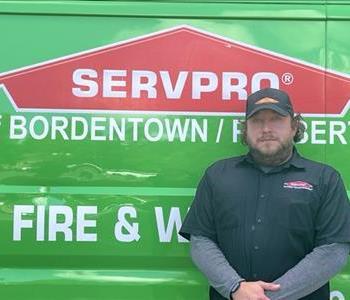 Head Shot, male employee in black shirt